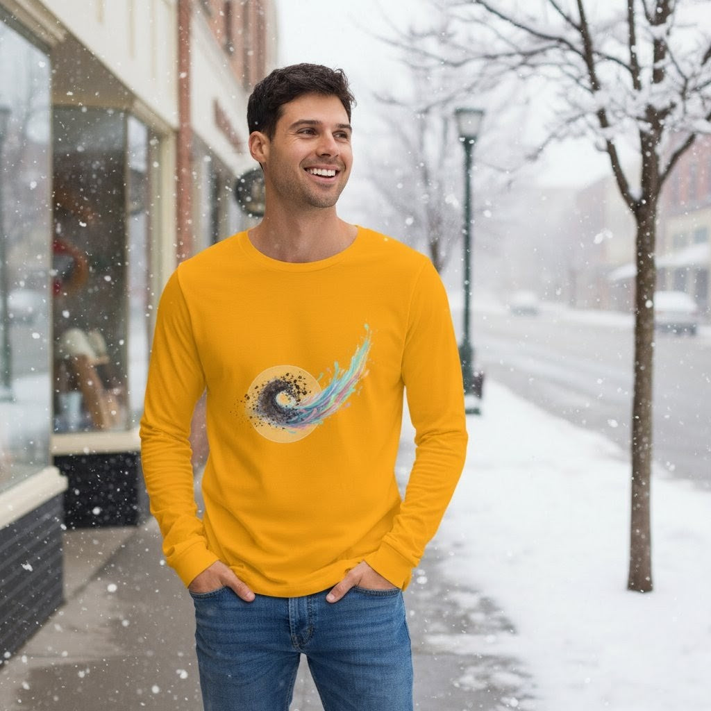 Man wearing a yellow long-sleeve shirt with a graphic design in a snowy street setting