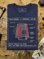 Heather navy T-shirt folded on a wooden workbench, showing a red air-filter cutaway and white airflow labels on the front above YOU CANNOT RUN CLEAN ON DIRTY AIR text.