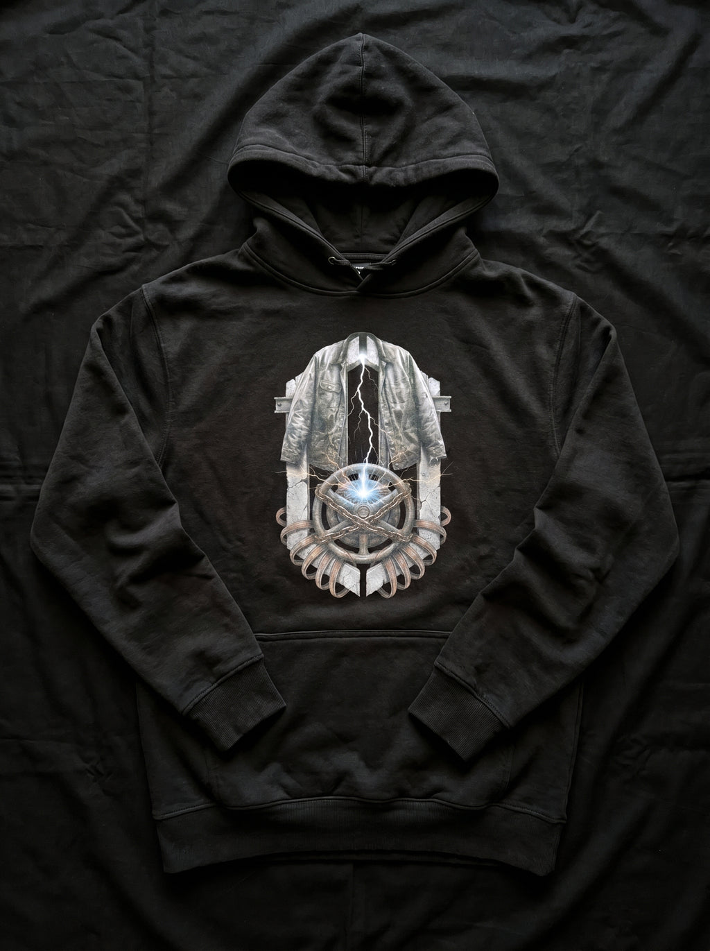 Detailed close-up of the high-definition industrial brutalism graphic artwork printed on the Selah Supply Co. Black Transmission: Ignition hoodie.