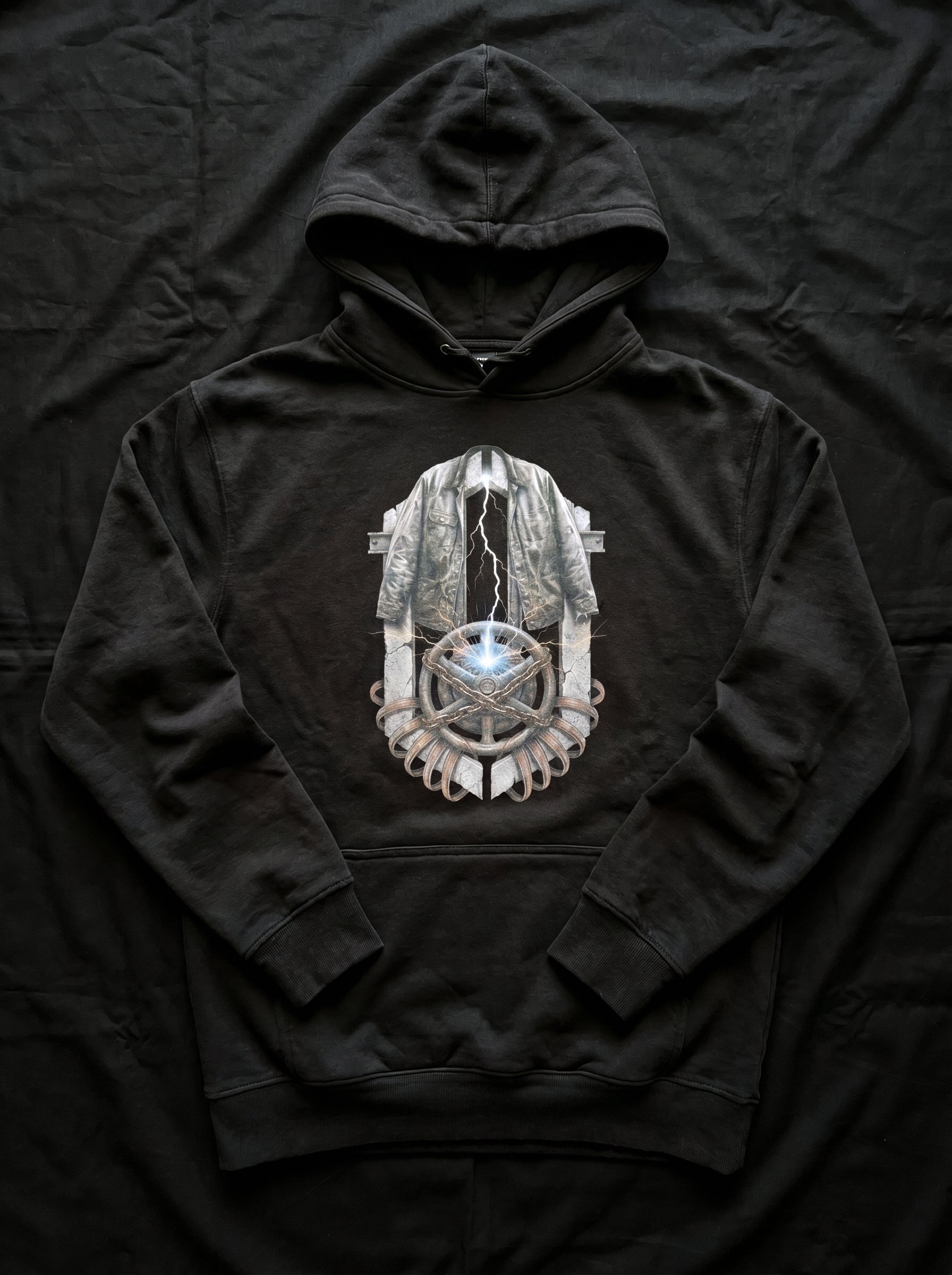 Detailed close-up of the high-definition industrial brutalism graphic artwork printed on the Selah Supply Co. Black Transmission: Ignition hoodie.