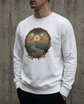 Selah Supply Co. The Not My Own Crewneck in White. Model wearing a Christian graphic sweatshirt visualizing Jeremiah 10:23. Features the 'Winding Path' of life and the 'Compass Sun' representing external Truth. Styled against a concrete wall.