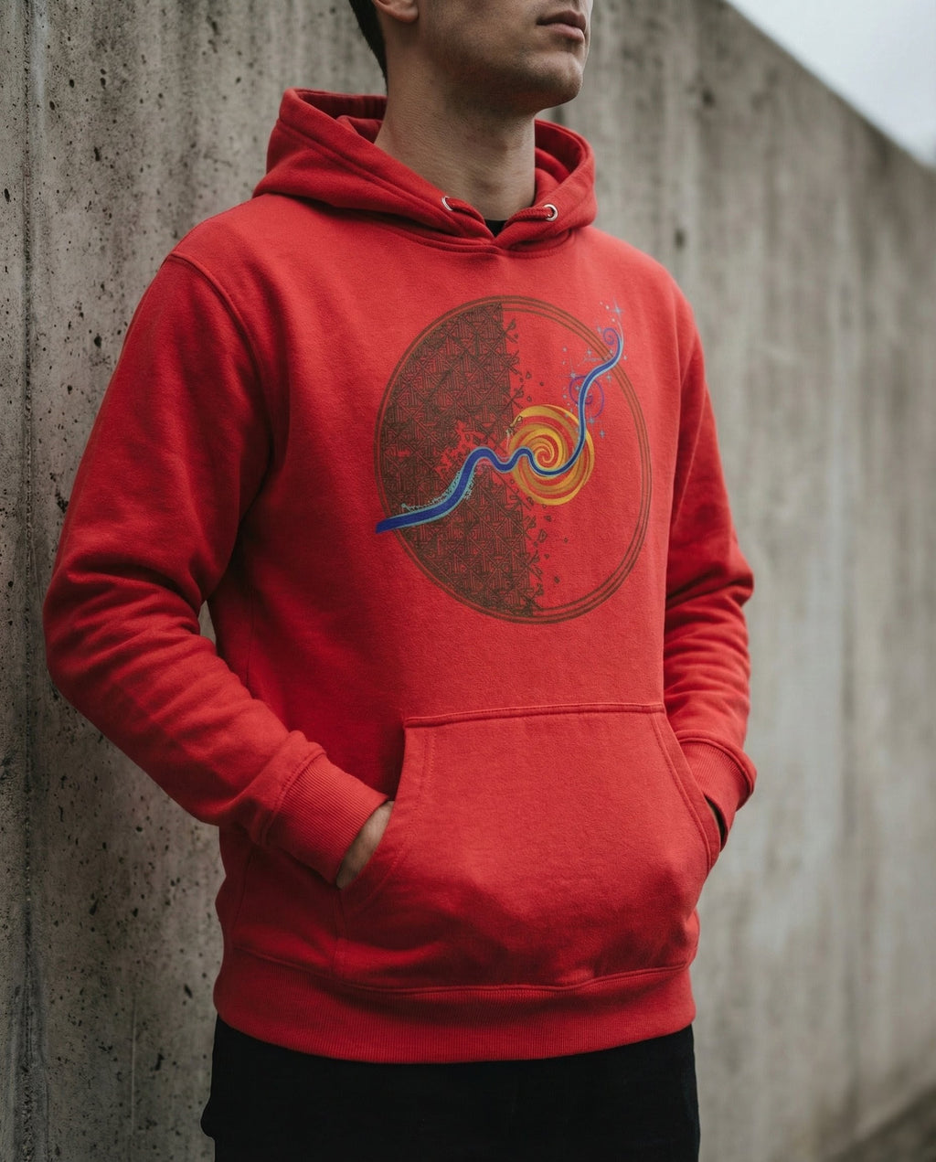 Model wearing the Team Red Rewire hoodie with circular grid and spiral artwork.