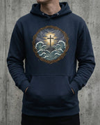 Model wearing the Navy Blazer Trouble Hoodie with cross above storm waves within a thorn border.