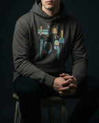 Model wearing the Vintage Black Bushel Hoodie with geometric lamps, teal and gold rays, colored blocks and a black grid.