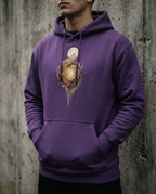 Model wearing the Purple Edify Hoodie with interwoven golden figures rising toward a light.
