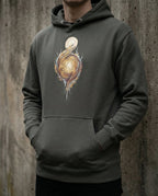 Model wearing the Vintage Black Edify Hoodie with interwoven golden figures rising toward a light.