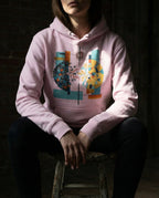 Model wearing the Lavender Output Hoodie with a divided dark and golden sphere with red lightning, a branch and blue flowing lines.