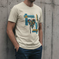 Selah Supply Co. The Search Me Tee in Heather Natural. Model wearing a Christian graphic tee featuring a compartmentalized geometric heart pierced by black lines of examination, based on Psalm 139:23. High-quality urban streetwear styled against a concrete wall.