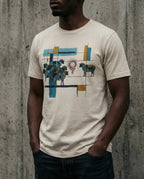 Model wearing the Heather Dust One Percent tee, showing geometric sheep, blue and gold bars and a red scribble separating one sheep from the flock.