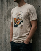 Model wearing the Soft Cream Lean Not Tee with hands, geometric heart, winding white path and cross artwork on the front.