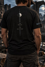 Back view of a model wearing a black heather T-shirt with a moon, fine vertical drafting lines, and THE BREACH & THE BLUEPRINT lettering.