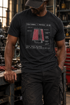 Front view of a standing model in a workshop, wearing a black heather T-shirt with a red air-filter cutaway, white airflow arrows, and technical labels centered on the front.