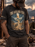 Model wearing a charcoal heather T-shirt with THE ASHLAND EXIT above robed figures on a cracked path, towering blue waves, broken chains, and a distant column of fire and smoke.