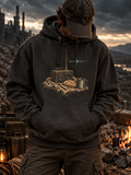 A person wearing a dark charcoal gray hoodie with a vintage radio and bread graphic on the chest, standing outdoors in a rocky, dramatic landscape at dusk.